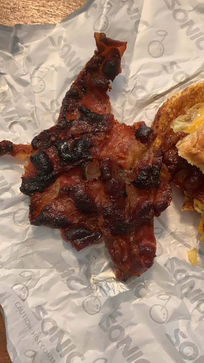 mandmladybug's tweet photo. @sonicdrivein in what world is this OK to serve?? I paid actual money for burnt bacon (which ruined my breakfast sandwich). #LessonLearned https://t.co/mbsGMcvAm1