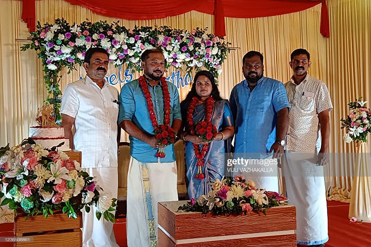 Groom Friedrich Engels (2L), bride Bismitha along with Communist party members Marx (L), Lenin (2R) and Ho Chi Minh (R) posing for pictures during their wedding ceremony held in Thrissur, Kerala state, on 14 November. (Picture: AFP) #India