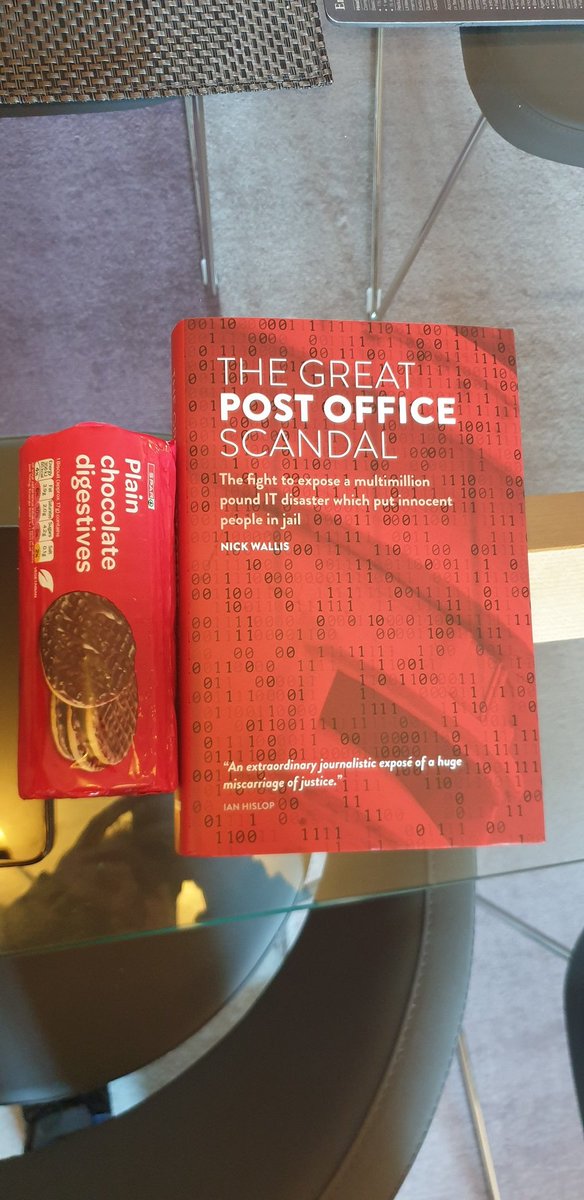 At the publishers to see and sign some of the books. They have bought matching biscuits.