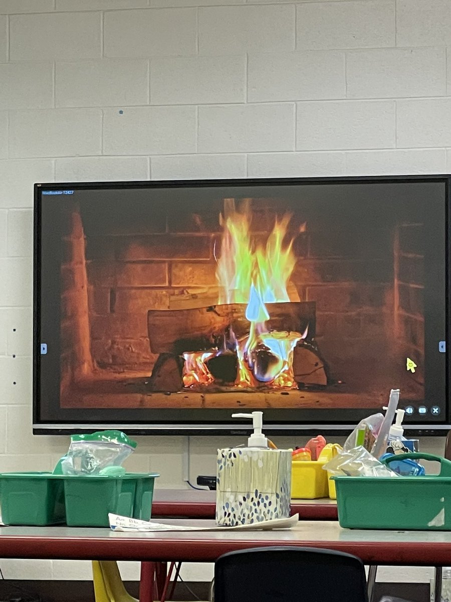 Team plan by the fire.