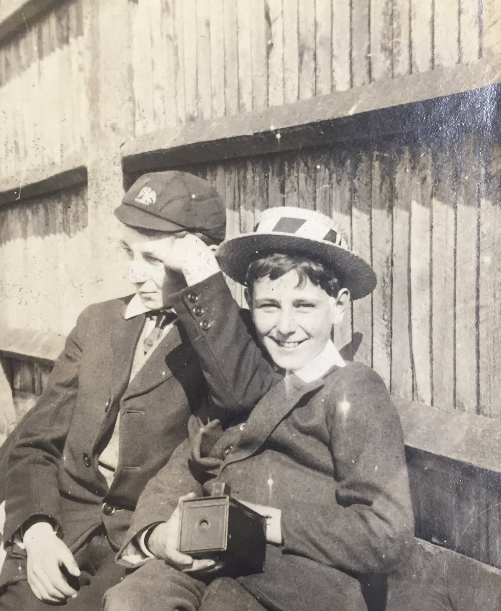 stjarchives's tweet photo. Today's photograph shows #schoolhats from the 1910s. Two junior boys sitting beside the senior field @StJohnsSurrey possibly watching and taking photos of a cricket match @OldJohnians #SchoolCaps #StrawBoater #BrownieBoxCamera #FromTheArchives #SchoolHistory https://t.co/yJbc7YFA4p