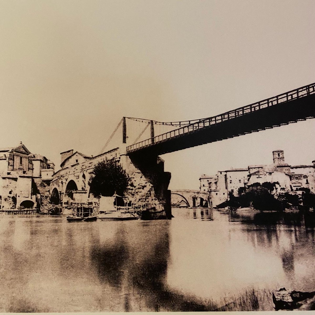 EricJLyman's tweet photo. Fascinating old photos of #Rome from a new exhibit at city hall on #ViaPetroselli: in order, #PonteRotto, #Vatican, and #PiazzaVenezia. Check out my Instagram account (@EricJLymanRome) for more details about the shots. @StefCaviglia @Roma https://t.co/DVrCFtuQtT