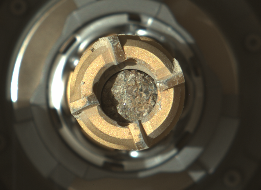 NASAPersevere's tweet photo. Another little piece of Mars to carry with me. 

My latest sample is from a rock loaded with the greenish mineral olivine, and there are several ideas among my science team about how it got there. Hypotheses are flying! Science rules. #SamplingMars https://t.co/L6lhCNdqWq https://t.co/bFXxExhS1P
