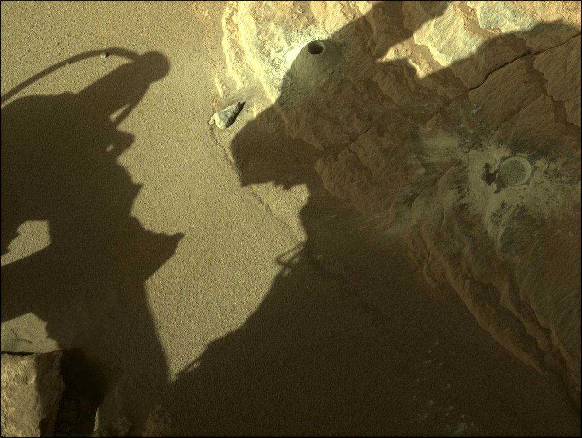 NASAPersevere's tweet photo. Another little piece of Mars to carry with me. 

My latest sample is from a rock loaded with the greenish mineral olivine, and there are several ideas among my science team about how it got there. Hypotheses are flying! Science rules. #SamplingMars https://t.co/L6lhCNdqWq https://t.co/bFXxExhS1P