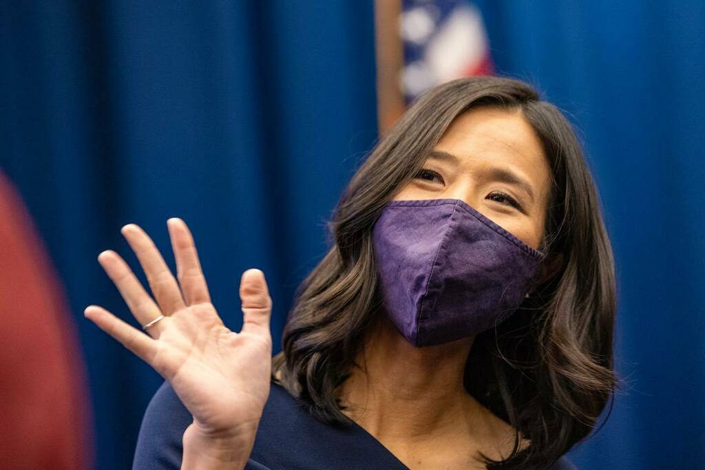 With her family by her side, Michelle Wu takes the oath of office as the next Mayor of Boston in the City Council Chamber at Boston City Hall. She is the first woman and the first person of color to be elected as Mayor of Boston. (Jesse Costa/WBUR) instagr.am/p/CWWZpLgvVZV/