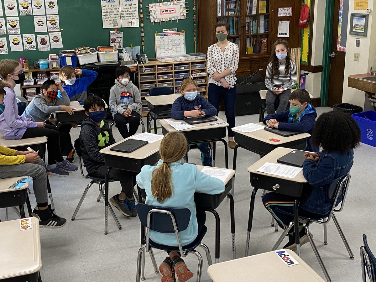 Preparing for our upcoming book clubs by watching a student discussion and making careful observations.