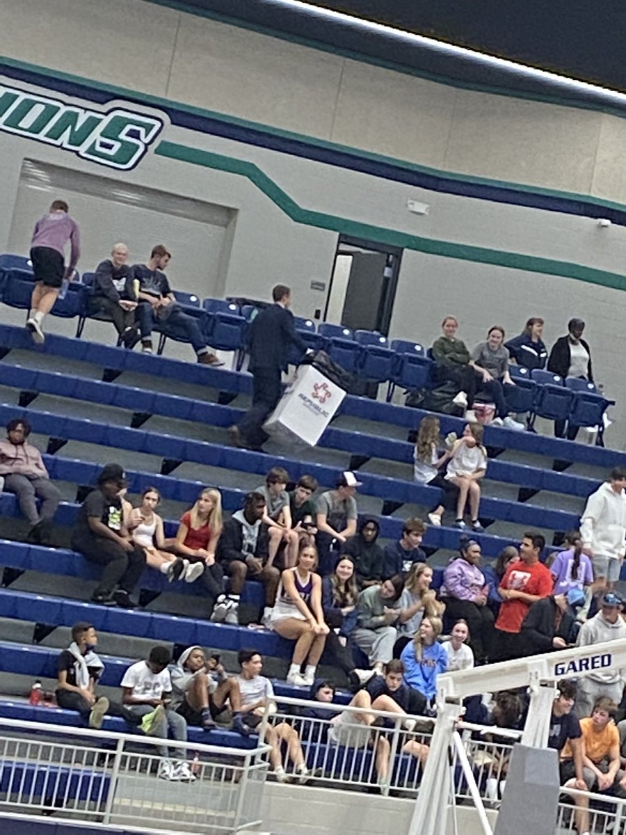 RTScan4's tweet photo. @Dr_J_Smith Head of Upper School cleaning up the student section after @LRCA_Hoops game. Leaders lead by example. Nothing better than being a @lrcawarriors https://t.co/w9qoFMg5rN