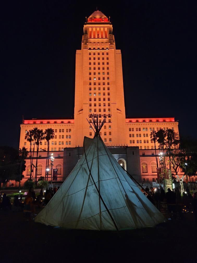 CalEndow's tweet photo. Sunday night, Los Angeles City Hall was bathed in Orange light to remember and raise awareness of Native children  lost to the Boarding School Era and the survivors of that cultural genocide that still bear the wounds.

The road to healing begins with acknowledgement &amp; atonement. https://t.co/UEH55OuE1a