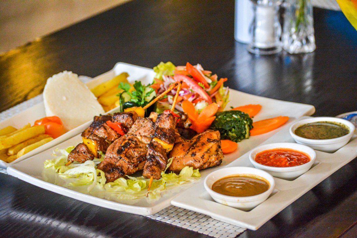 PrideinnHotels's tweet photo. Experience the discerning tastes of our iconic signature barbecue platter. Make reservations for the weekend and enjoy access to our swimming pool at @PrideInnAzure. Call (+254) 709 716000. #BarbecueWeekend #PrideInnAzure https://t.co/7jM9sPT3sc