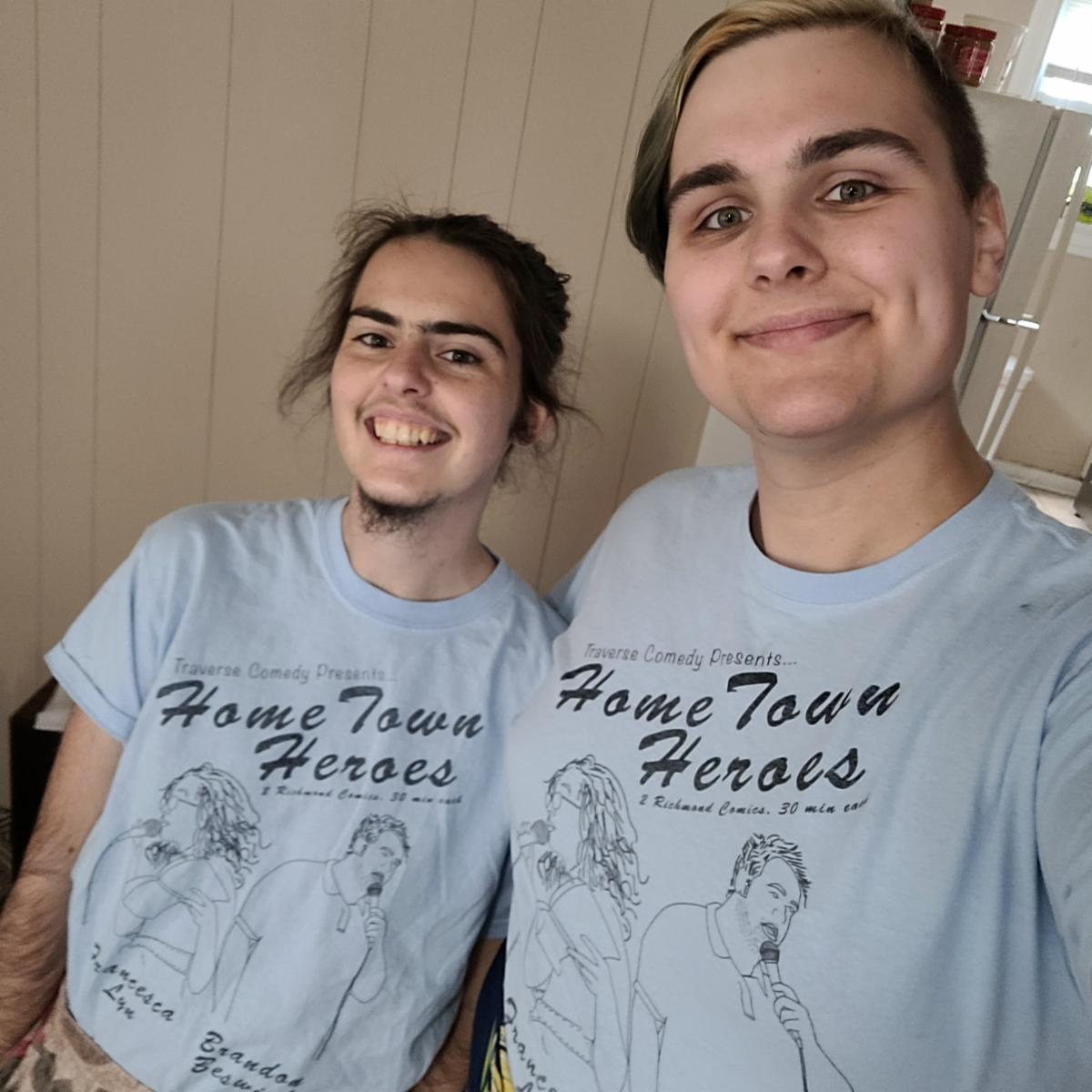 TraverseComedy's tweet photo. These 2 Producers are so so excited for Home Town Heroes This Friday at @strangewaysrva! Half of the ticket sales go toward @mad_rva AND we'll have these t-shirts for sale as well! and half of profits from these shirts will ALSO go to mad rva! #ComedyRVA #RVA #ThingsToDoInRVA https://t.co/fCTb1YCEht