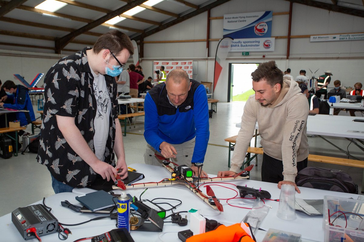 IMechEUAS's tweet photo. Getting hands-on in the hanger at the #UAS2021 flyoff for this week's #throwbackthursday - can't wait for next summer! https://t.co/vcRLWMWuQ1