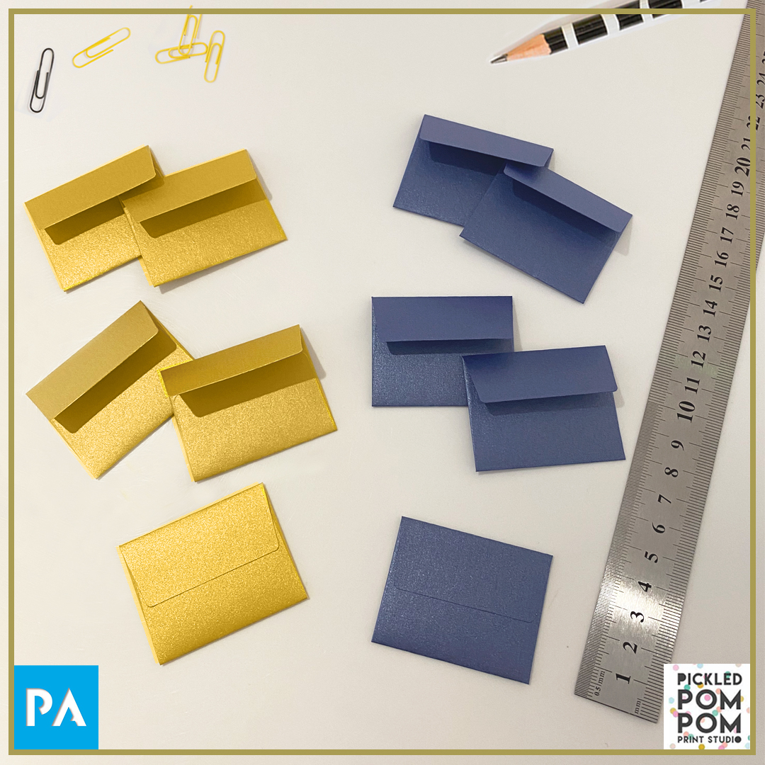paperassist's tweet image. We made these tiny 40x50mm envelopes for Laura from @pickledpompom - a lovely Irish business, for her product 'little wishes' (pictured here). A mini old-fashioned brass frame accompanied by these 2 envelopes.Stocks used are STARDREAM - Sapphire and Fine Gold.⁣⁣
#customenvelope
