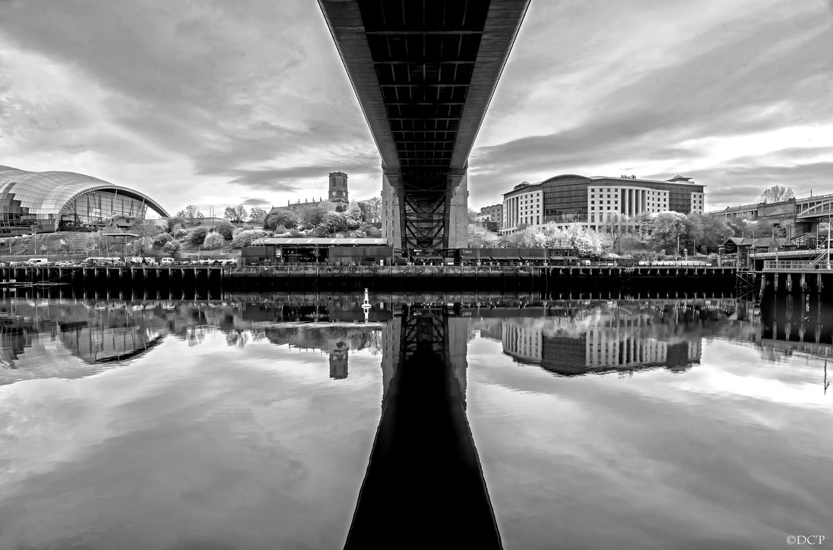 'Underneath' Little surface wind on the #rivertyne underneath the iconic #tynebridge highlighting the #sageartsctr #hiltonhotel & #stmarysheritagecentre . #newcastlequayside