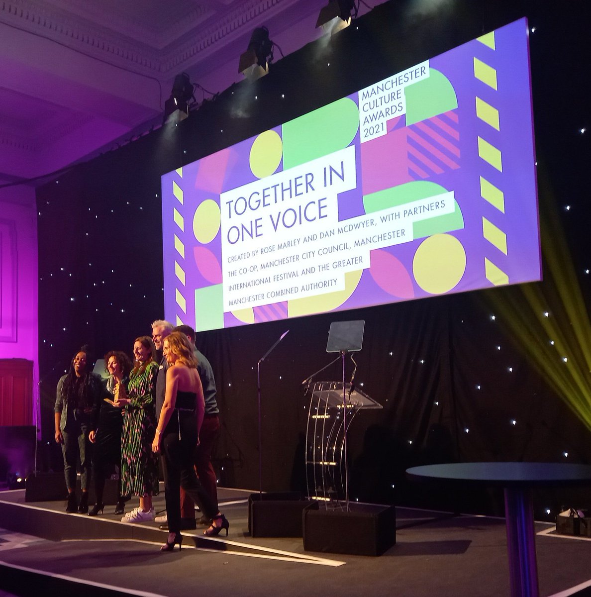 The #McrCultureAwards for BEST EVENT goes to Together in One Voice! Thousands of people 
took part in the joyous mass doorstep singalong to lift our spirits during lock-down THANKYOU! 
<a href="/TogetherMCR/">together in one voice</a> <a href="/RoseMarley1/">Rose Marley</a> <a href="/coopuk/">Co-op</a> <a href="/greatermcr/">Greater Manchester Combined Authority</a> <a href="/ManCityCouncil/">Manchester City Council</a> <a href="/danielmcdwyer/">Dan McDwyer</a> 
@MIFestival