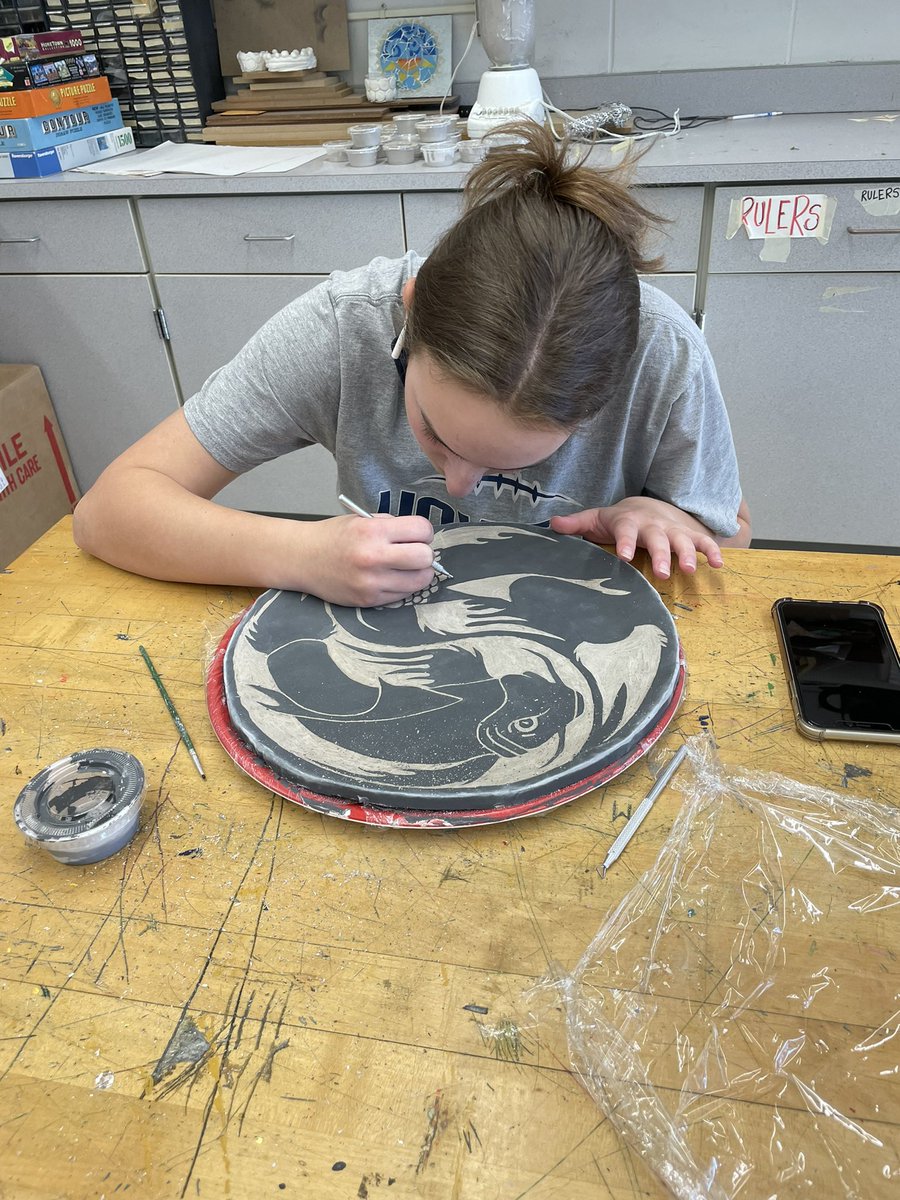 Applied art 2 students working on Sgraffito platter! So proud of this young lady’s hard work!