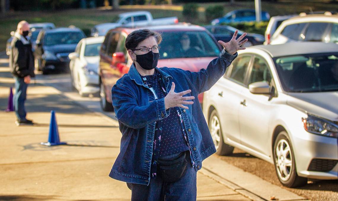 Chrys Browne, a Wake County Public Schools central office worker, helps with morning carpool at <a href="/AversboroElem/">Aversboro Elementary School</a>. Wake County is having central office staff volunteer at schools to help them deal w/ staffing shortages. #wcpss #nced