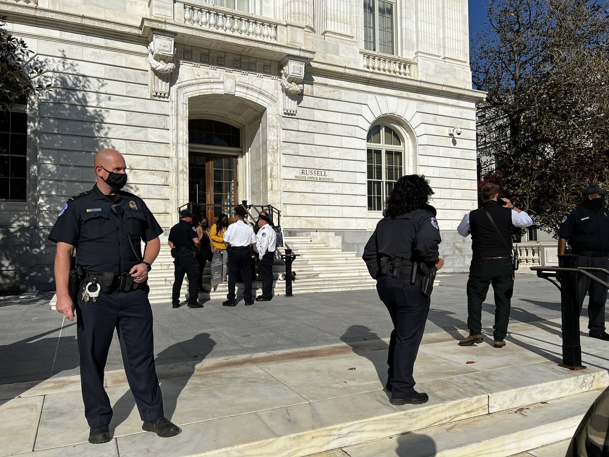 R2HAction's tweet photo. We spread the ashes of our deceased loved ones on the steps of the Senate! Police were not too happy #STOPCOVID #vaccineequity https://t.co/yySDdmOGHn