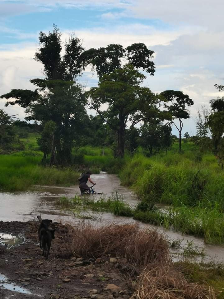 Going to the shop. The stream had overflowed somewhat.