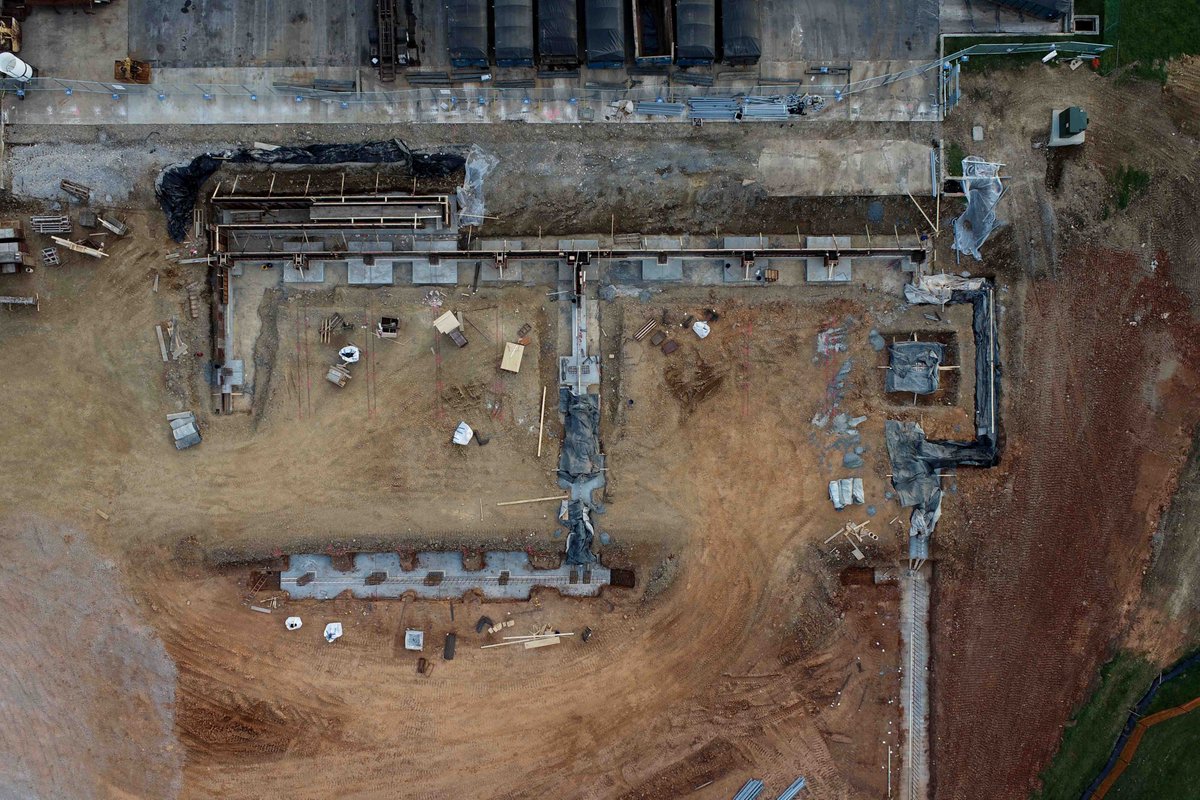 teamNUTEC's tweet photo. We’re happy to share a project update from on-site at US Ecology @USEcologyJobs Here are drone shots of site work where we’ve started earthwork cutting/filling, pouring concrete, and setting rebar for the pre-engineered metal building area. #designbuild construction is underway. https://t.co/fVfHdVbGFp