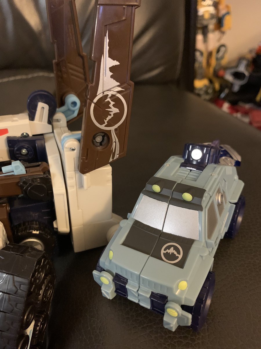 Landquake is an Autobot and Brushguard is a Decepticon but faction means nothing when you’re in the Mountain Logo Club.