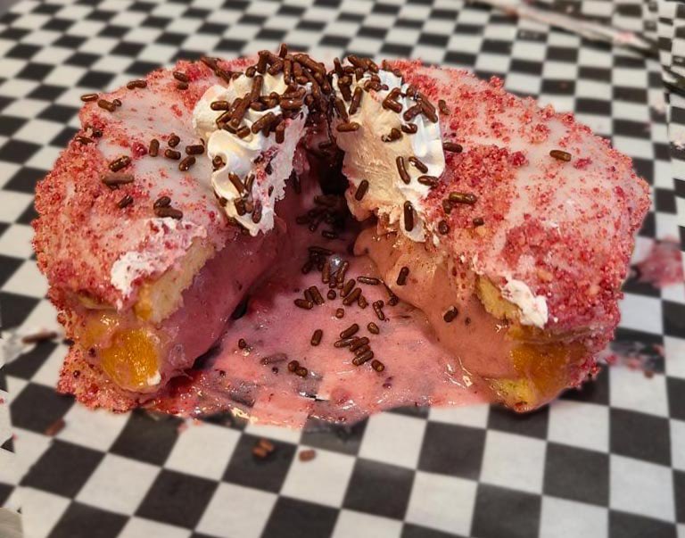 wicked_donuts's tweet photo. Introducing the TurkleBerry! This new bird is gonna help fill that holiday hunger and delight your tastebuds. Filled with yummy Cranberry Cream, Vanilla iced and topped with Berry Crumble, Vanilla Whip and Chocolate Sprinkles. #wickeddonutslasvegas #wickednevertastedsogood https://t.co/2pKOHd2sRz