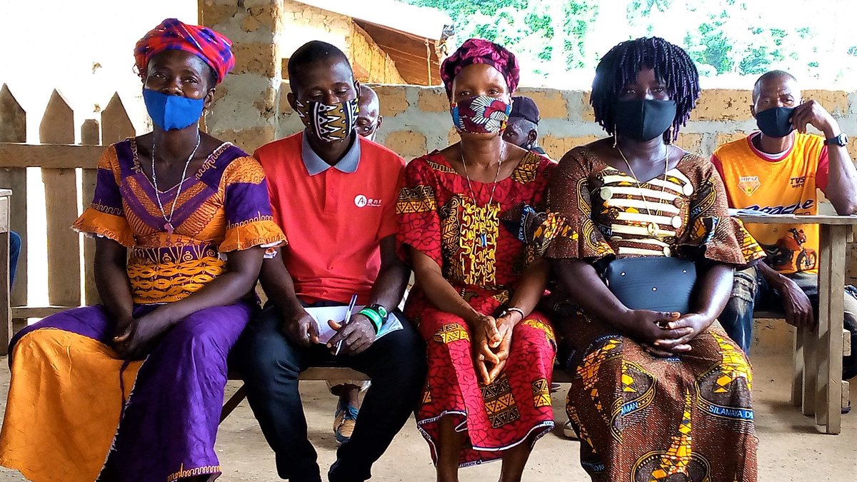 Bluyema Community Land Development and Management committee chairperson, Gbelee Sumo, sits far right with the rest of the executive committee at a meeting.