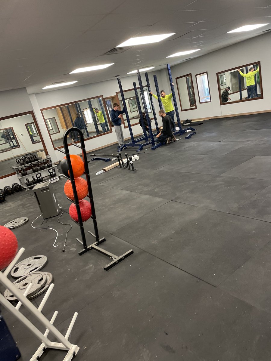 LyonScotsFB's tweet photo. New weight room coming along!! Our coaching staff working to get the facility into place!! #LyonStrong https://t.co/cKZ1anbPux