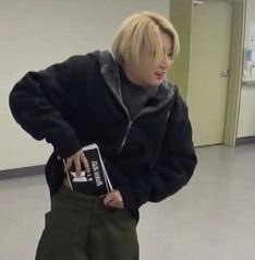 jungkook putting cue cards in his pants