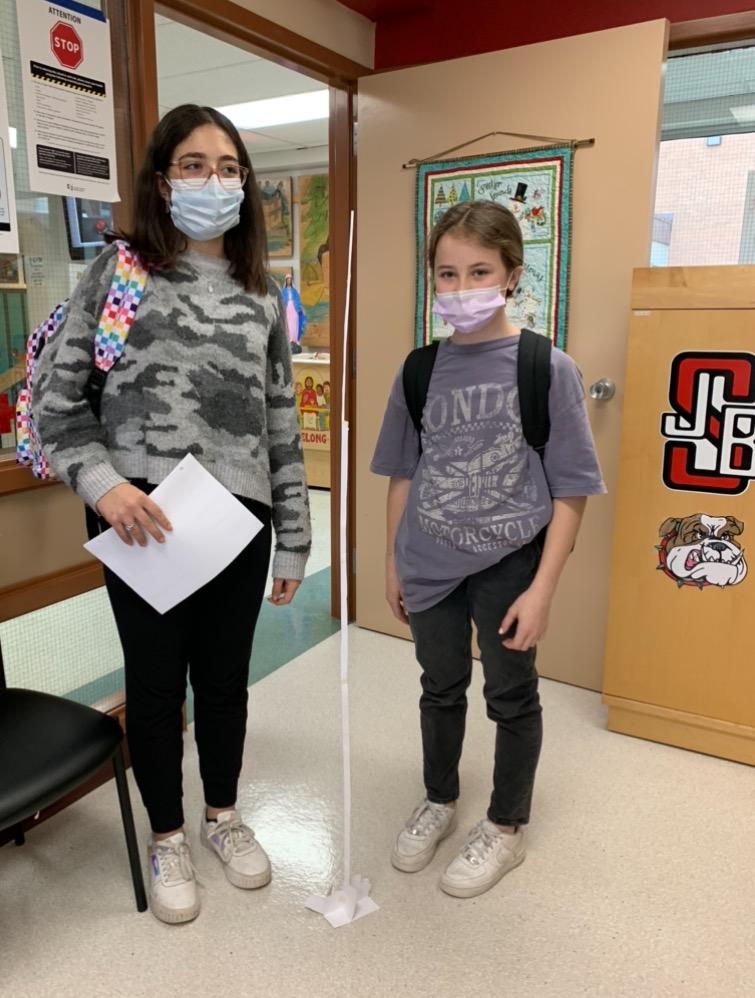 SJB_CCSD's tweet photo. And who made a free standing structure reach 1.5 m tall out of a piece of paper and tape?  These two did!  #CriticalThinking #inquirylearning https://t.co/I7urgKyRbV