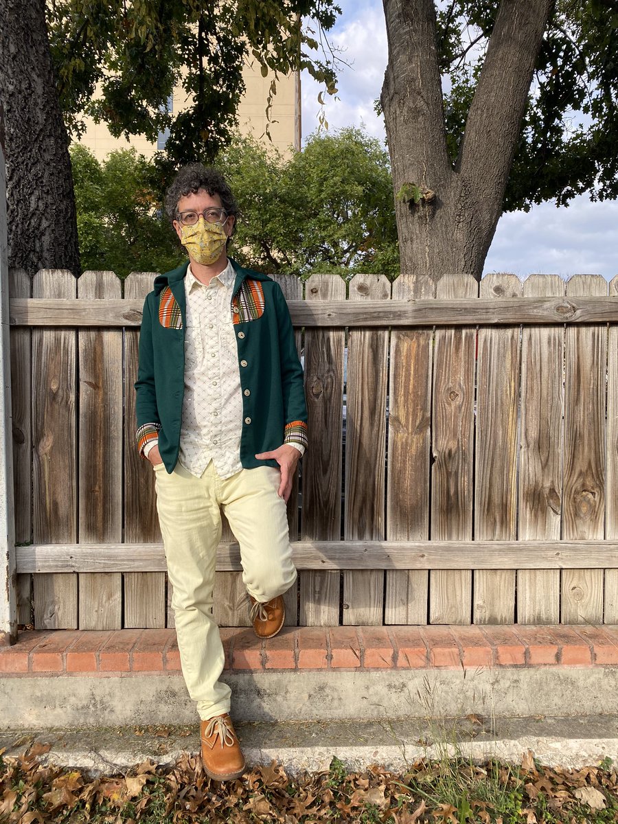 whatisnicholas's tweet photo. On his birthday eve, Nicholas is wearing a @patagonia pearl button shirt, a thrifted shirt-jacket of uncertain origin, Berlin pants, and Copenhagen Duckfeet shoes. The mask that completes the outfit was a last-second gift from @LindseyGCarnett. https://t.co/HxkBVtKLgB