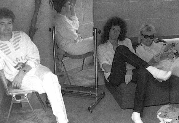 Brian may and John Deacon with a fan.