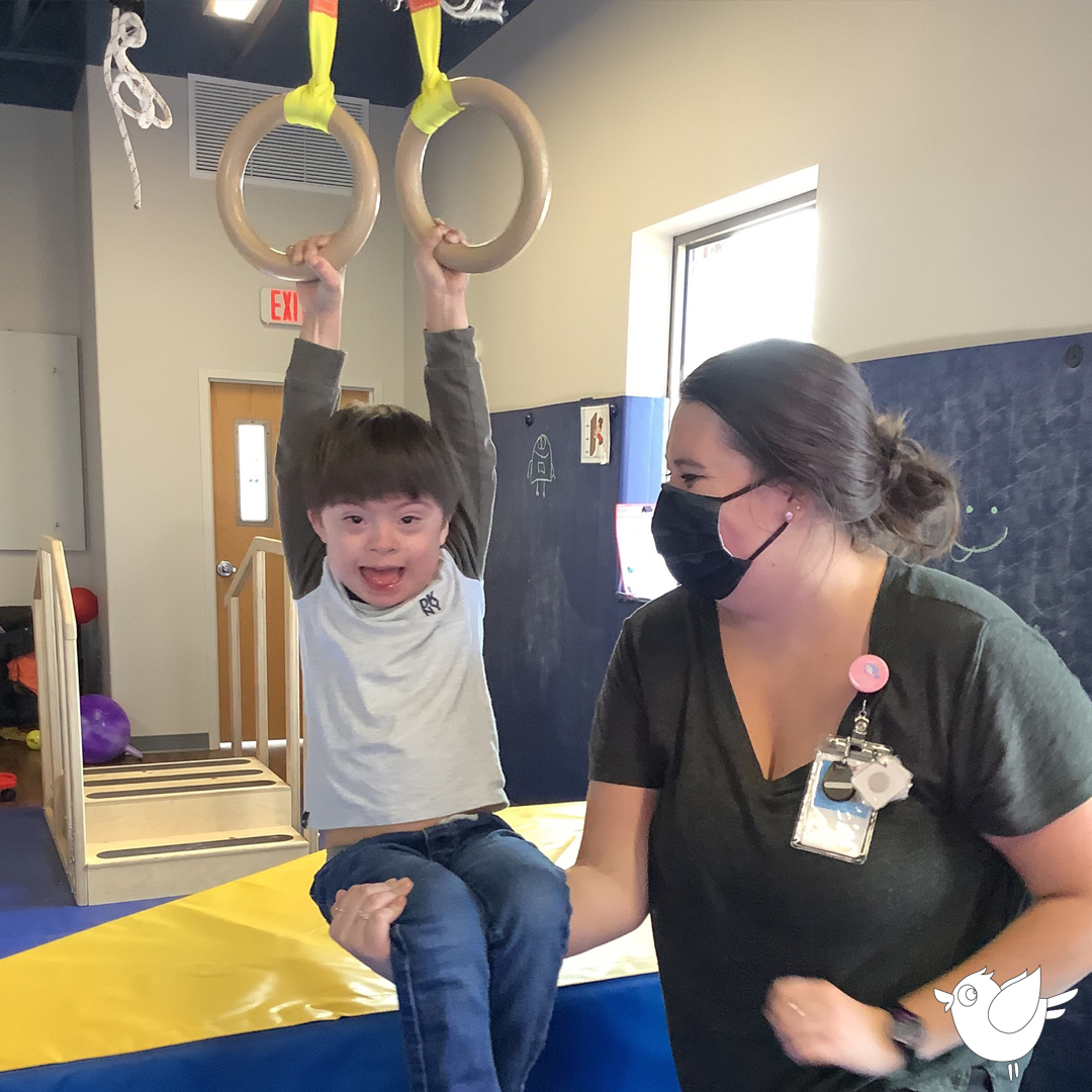 Swinging helps develop fine motor skills, grip strength, coordination, core muscles, and more. Plus, it's super fun! #bluebirddayprogram #wheaton #preschool #kindergarten #swing #swings #therapygym #therapeuticgym #pediatricgym #kidsgym #kidsswing #therapyswing #physicaltherapy