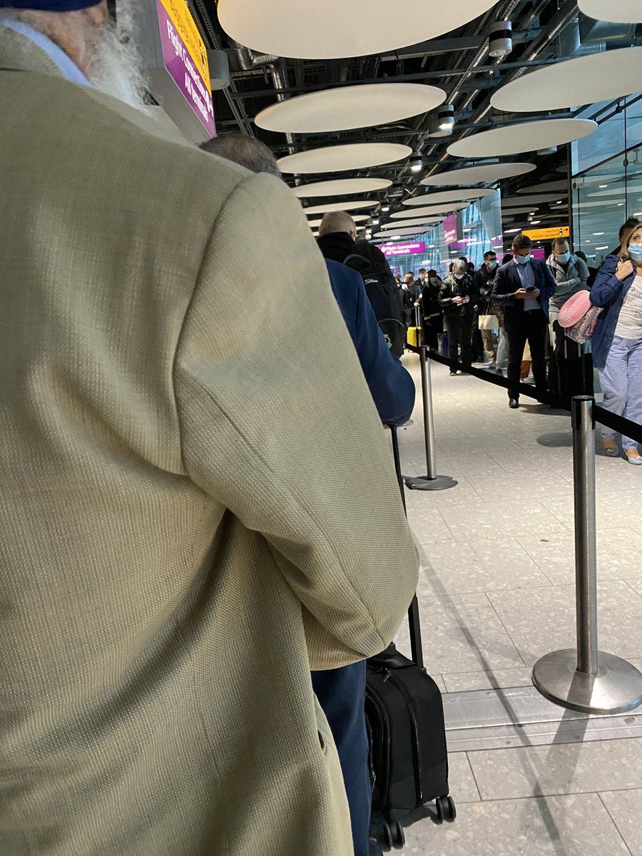 Heathrow airport squid games, winding roads of humans. Like seriously winding #Heathrow