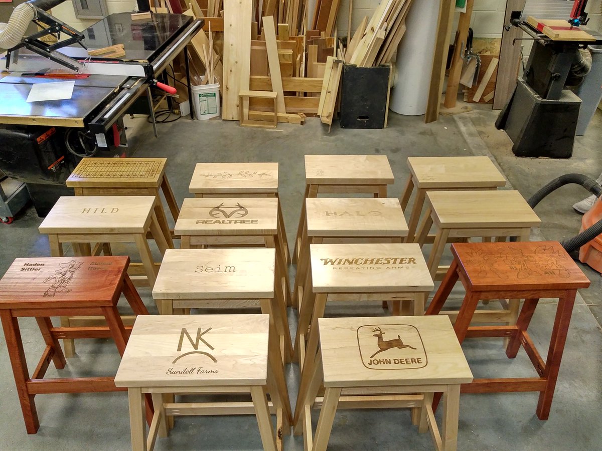 MrSmiths_Shop's tweet photo. Several weeks ago the Cabinetmaking class finished up their barstools using reclaimed maple boards. They finished them off utilizing the @glowforge laser on the seats. Check out the finished products! @CrossCounty1 https://t.co/3r5LdlqKJk