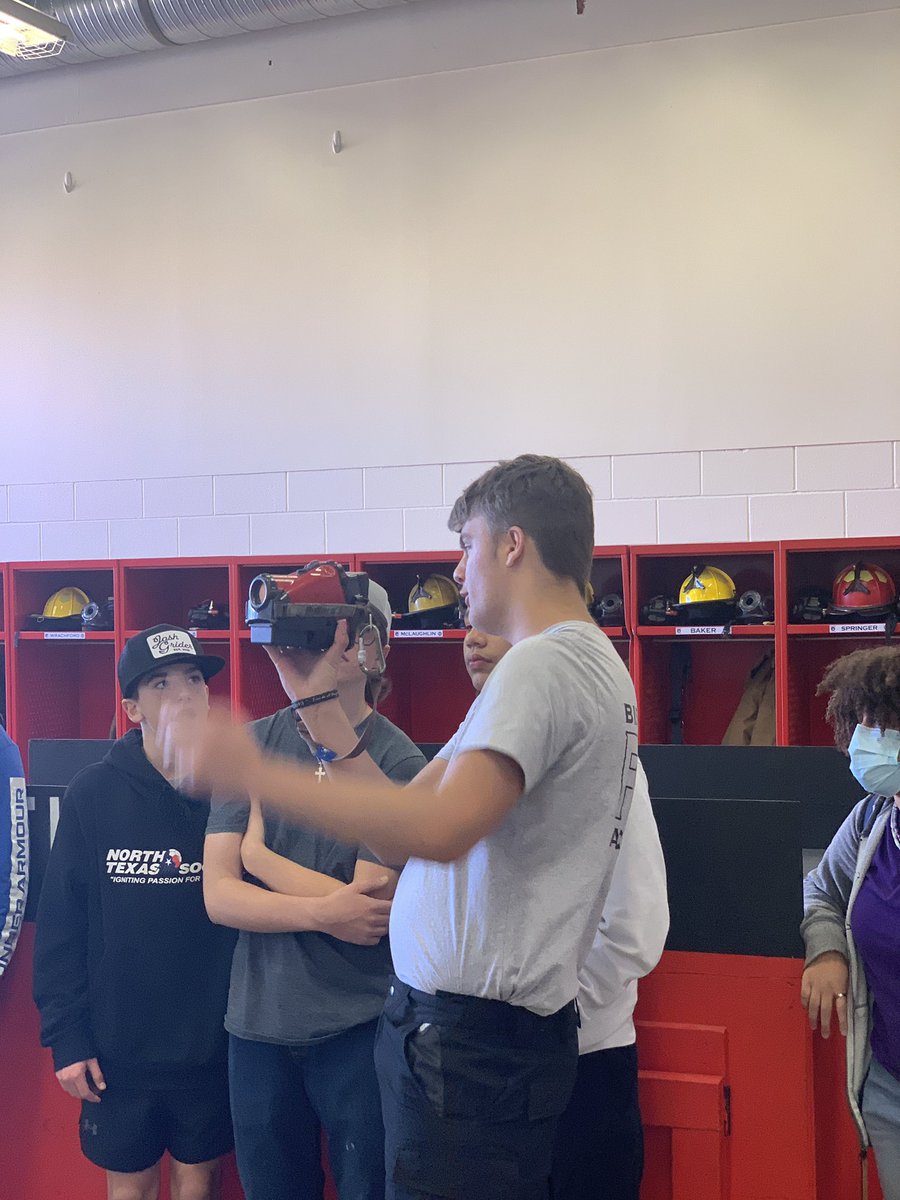 BfdCte's tweet photo. Fire Academy junior class Officer Adam Springer shows next year’s incoming freshman a thermal camera and talks about his experience in the BISD Fire Academy @burleson_cte @CHSSpartans #FireAcademy #growourown https://t.co/m6vnjiQIjN