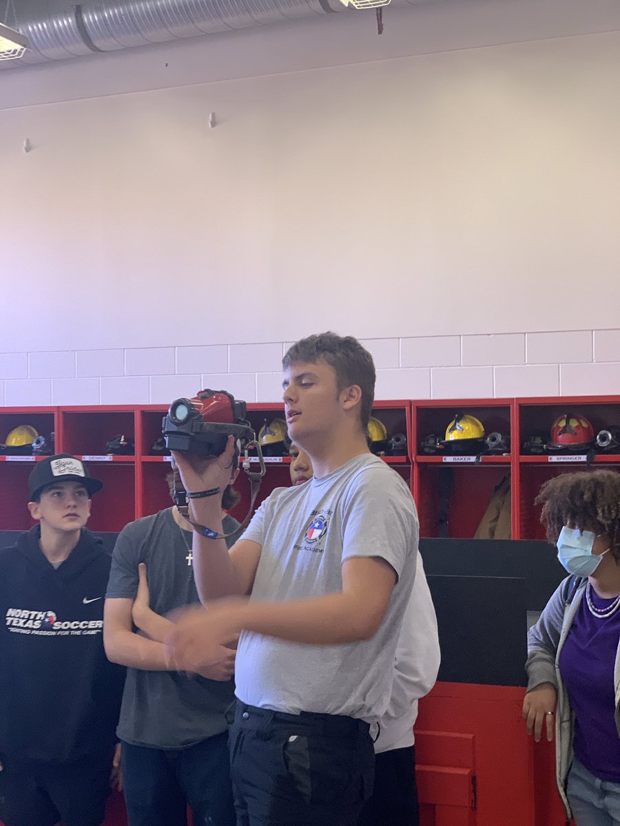 BfdCte's tweet photo. Fire Academy junior class Officer Adam Springer shows next year’s incoming freshman a thermal camera and talks about his experience in the BISD Fire Academy @burleson_cte @CHSSpartans #FireAcademy #growourown https://t.co/m6vnjiQIjN