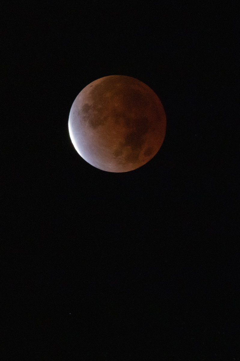 sjuhawknews's tweet photo. Early this morning, the longest lunar eclipse in 580 years was visible for much of the globe, including in Philadelphia. In case you weren’t brave enough to wake up at 4 a.m., when the moon was 97% covered by Earth’s shadow, here’s a view from Mitchell Shields ’22. https://t.co/kGaSizWVVv