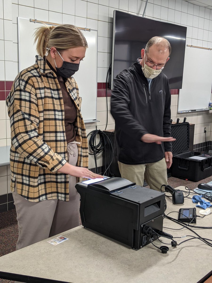 ISU_TES's tweet photo. Senior in Elementary Education, Hannah, is shown proper finger placement by a @IowaBOEE representative during her fingerprinting appointment. #ISUedPrep Teacher Candidates are fingerprinted the semester prior to their Student Teaching. #cycloneteachers https://t.co/5FBE3YBY6o