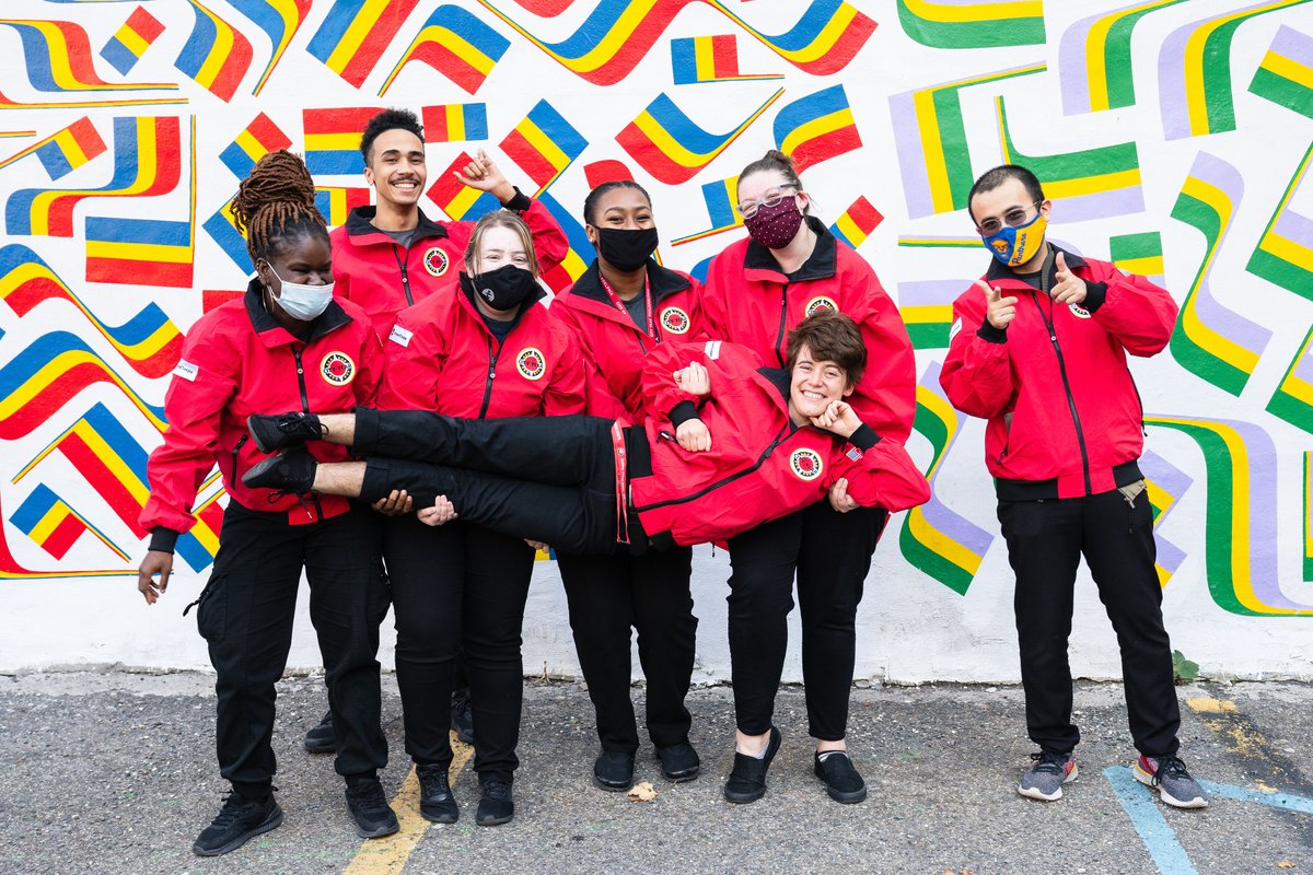 CityYearPhilly's tweet photo. Our @AmeriCorps members are jumping for joy because they're finally #RedJacketReady! After a long wait due to global shipping delays, our Corps members were thrilled to receive their full uniforms at the beginning of the month. Check out some of their silliest group poses! https://t.co/76668uaCPz