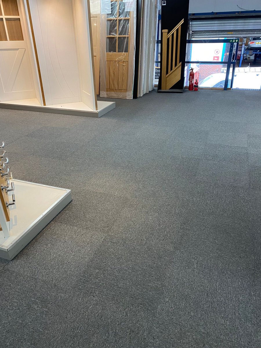 Commercial carpet tiles supplied and fitted to a local business showroom area - the checkered effect looks great. Colour is grey metal - we cater to all needs, for a free quote call 01244 291900 #chestertweets