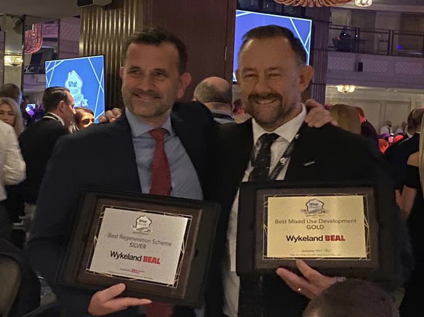 Wykeland's tweet photo. Our MD Dominic Gibbons and @BealHomes Chief Executive RIchard Beal with the Wykeland Beal Gold and Silver @What_House awards for the regeneration of @FruitMarketHull.
Brilliant to receive national recognition for creating this very special urban village.
#WhatHouseAwards2021 https://t.co/cXQon80Ulj