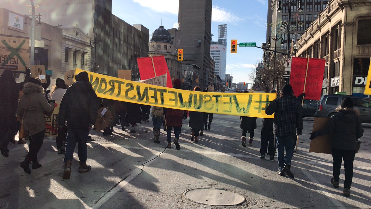 Over 100 ppl marching now through downtown Winnipeg. Chanting for #wetsuwetenstrong #rcmpofftheyintah and #LandBack