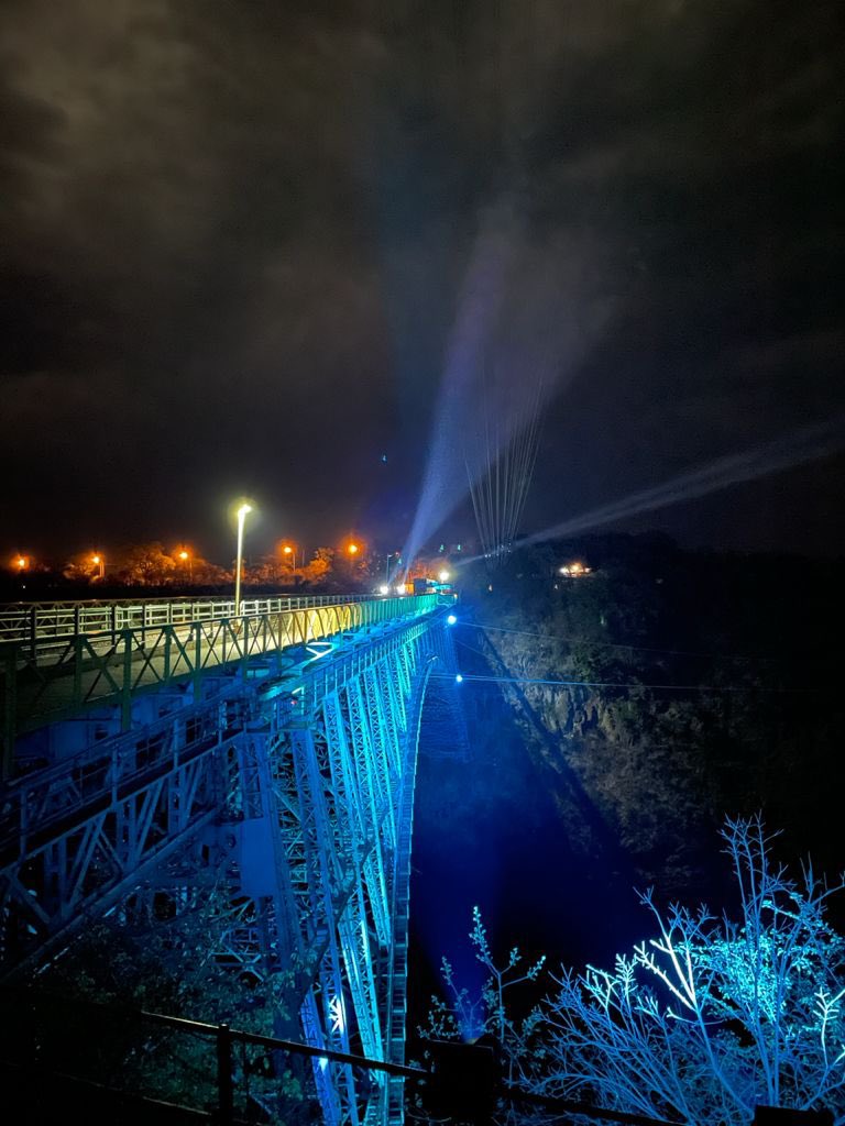 UNICEFZIMBABWE's tweet photo. Zimbabwe’s iconic Victoria Falls bridge bursts to blue in solidarity with child rights and reimagining a better future #foreverychild 

#WorldChildrensDay https://t.co/wJz7vPkiEK