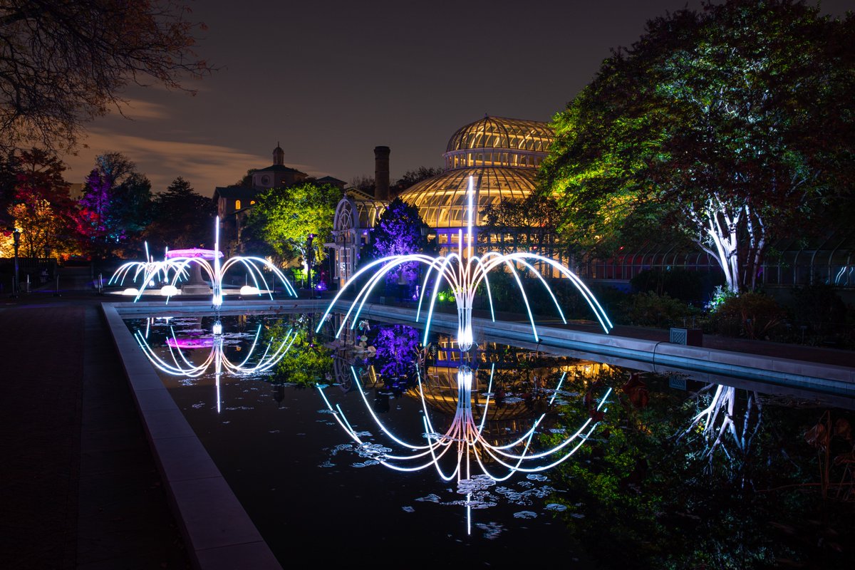 Gothamist's tweet image. The Brooklyn Botanic Garden is offering a new, illuminated after-dark experience called "Lightscape," a twinkling maze winding through their 52-acre landscape featuring 14,000 glowing orbs of light, a 98-foot-long tunnel, 20 treetop sculptures, and more. bit.ly/3CG3Wwo