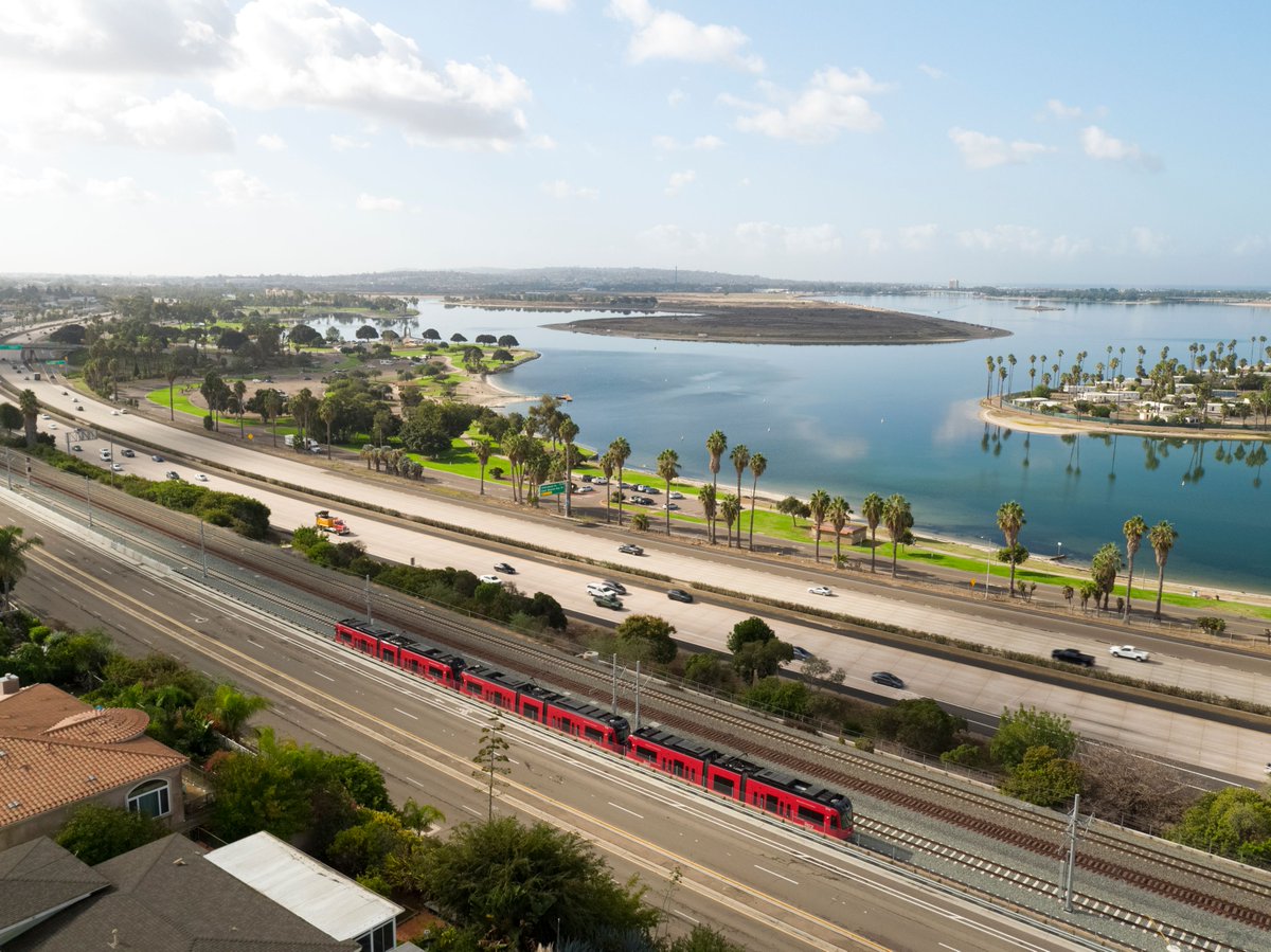SANDAG's tweet photo. Are you pumped?! 🚎 The Mid-Coast Extension of the @UCSanDiego Blue Line Trolley opens in TWO days.
Take a FREE @sdmts Trolley ride to take part in the fun!
Join us from 11a - 3p on Sunday, Nov. 21, for the festivities. 🥳
RSVP: https://t.co/eRXiz4AVG7
#MidCoastMilestone https://t.co/UxhEqNgZ2C
