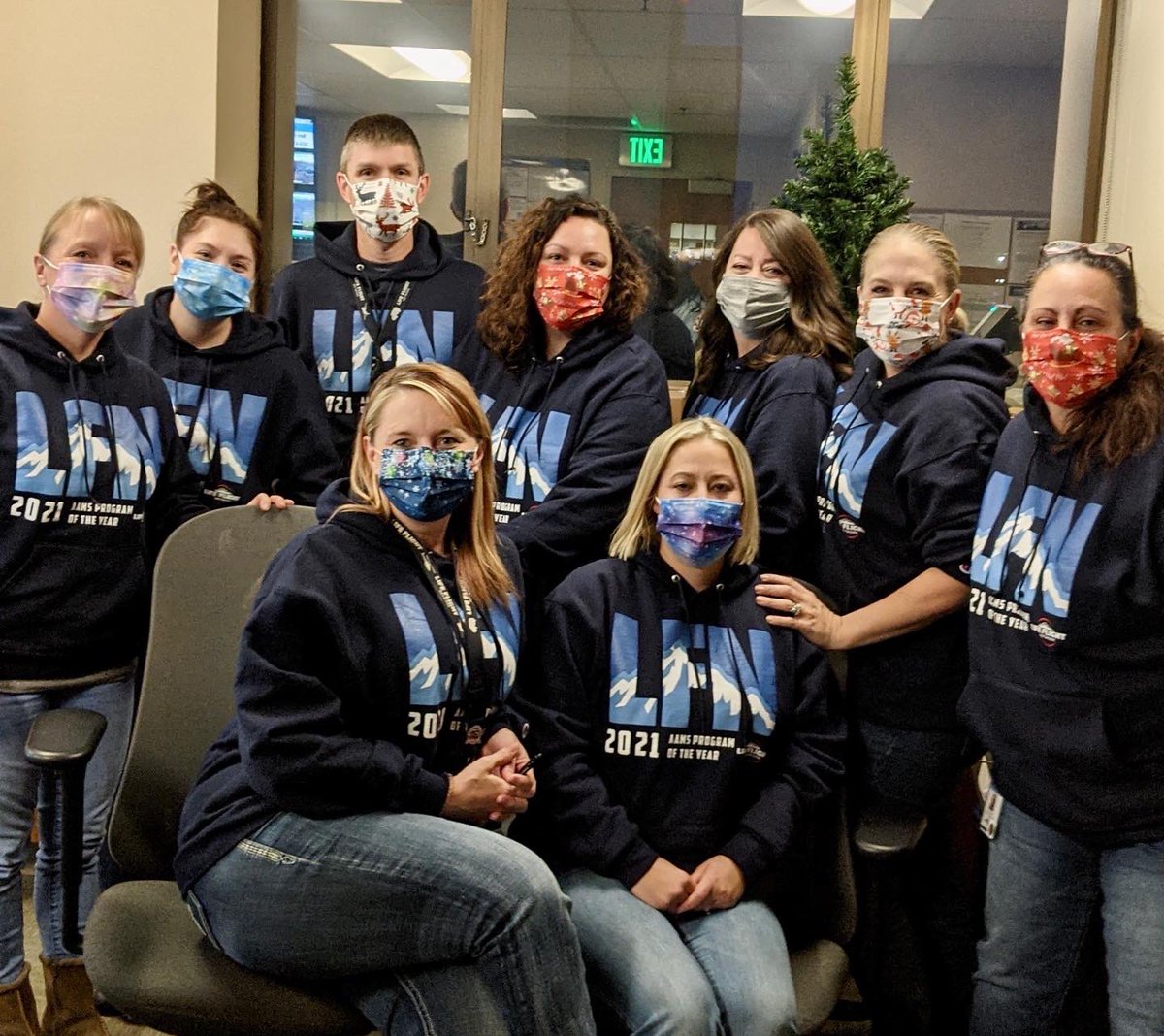 LifeFlightNtwrk's tweet photo. Itβs hard to tell but these hardworking, top of their field Communication Specialists and Operational Control Specialists are smiling under those masks, rocking their 2021 AAMS Program of the Year sweatshirts that we designed right here at LFN!
#lifeflightnetwork https://t.co/IZ0P7AG1wa