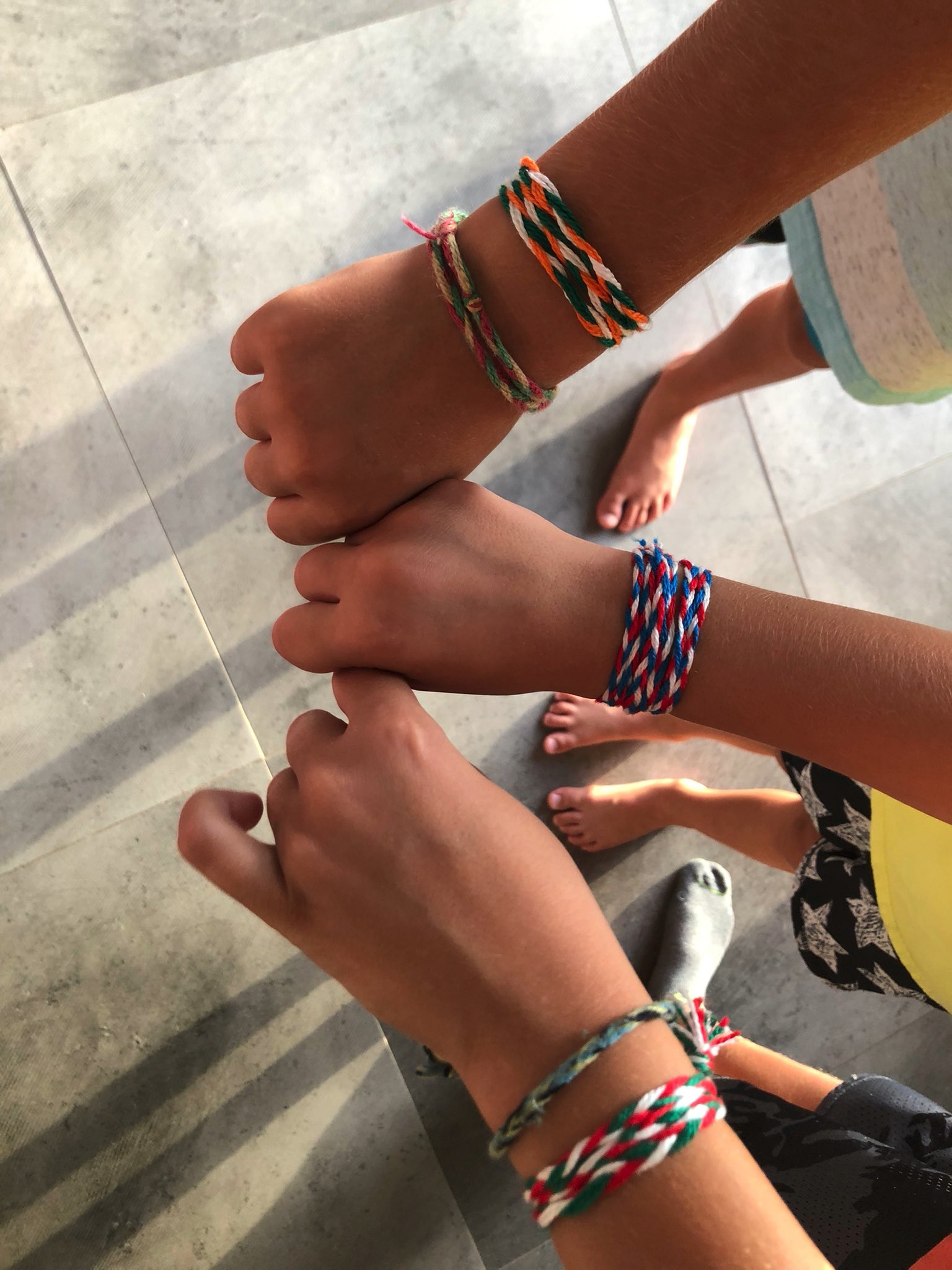 Hand with shop friendship band