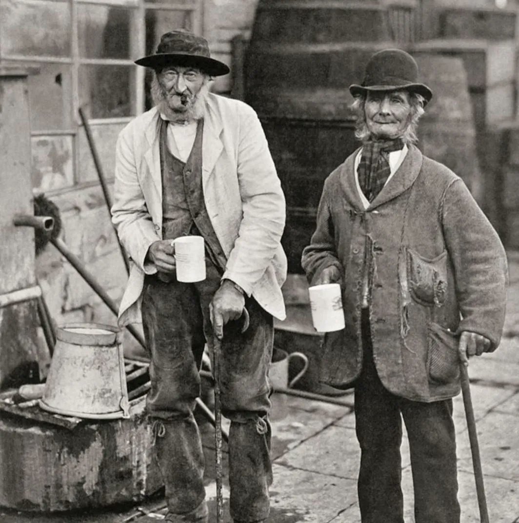 Two cider drinking friends outside an Inn , in Sommerset  taken by amateur photographer Benjamin Stone c1900