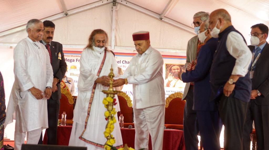 Gurudev's tweet photo. Distributed wheelchairs to more than 300 differently-abled in the presence of Hon. Shri @TCGEHLOT, Governor Karnataka. The camp was jointly organised by @artofliving, Shree Bhagwan Mahaveer Viklang Sahayta Samiti, @Rotary Bangalore &amp; @SBIMF. https://t.co/zz425nEUep