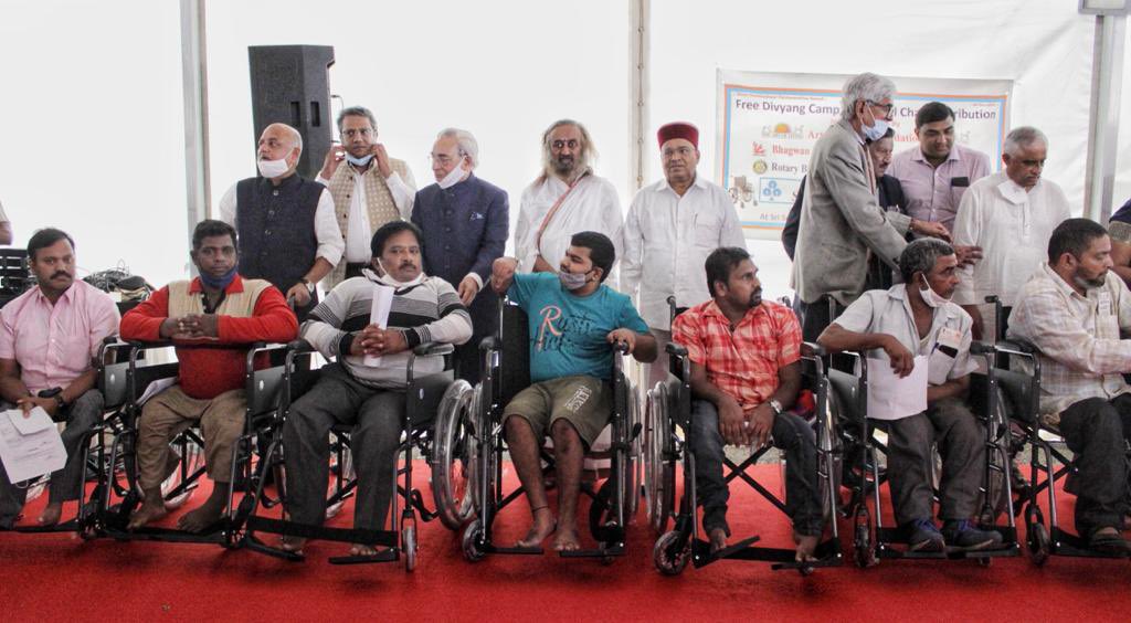Gurudev's tweet photo. Distributed wheelchairs to more than 300 differently-abled in the presence of Hon. Shri @TCGEHLOT, Governor Karnataka. The camp was jointly organised by @artofliving, Shree Bhagwan Mahaveer Viklang Sahayta Samiti, @Rotary Bangalore &amp; @SBIMF. https://t.co/zz425nEUep